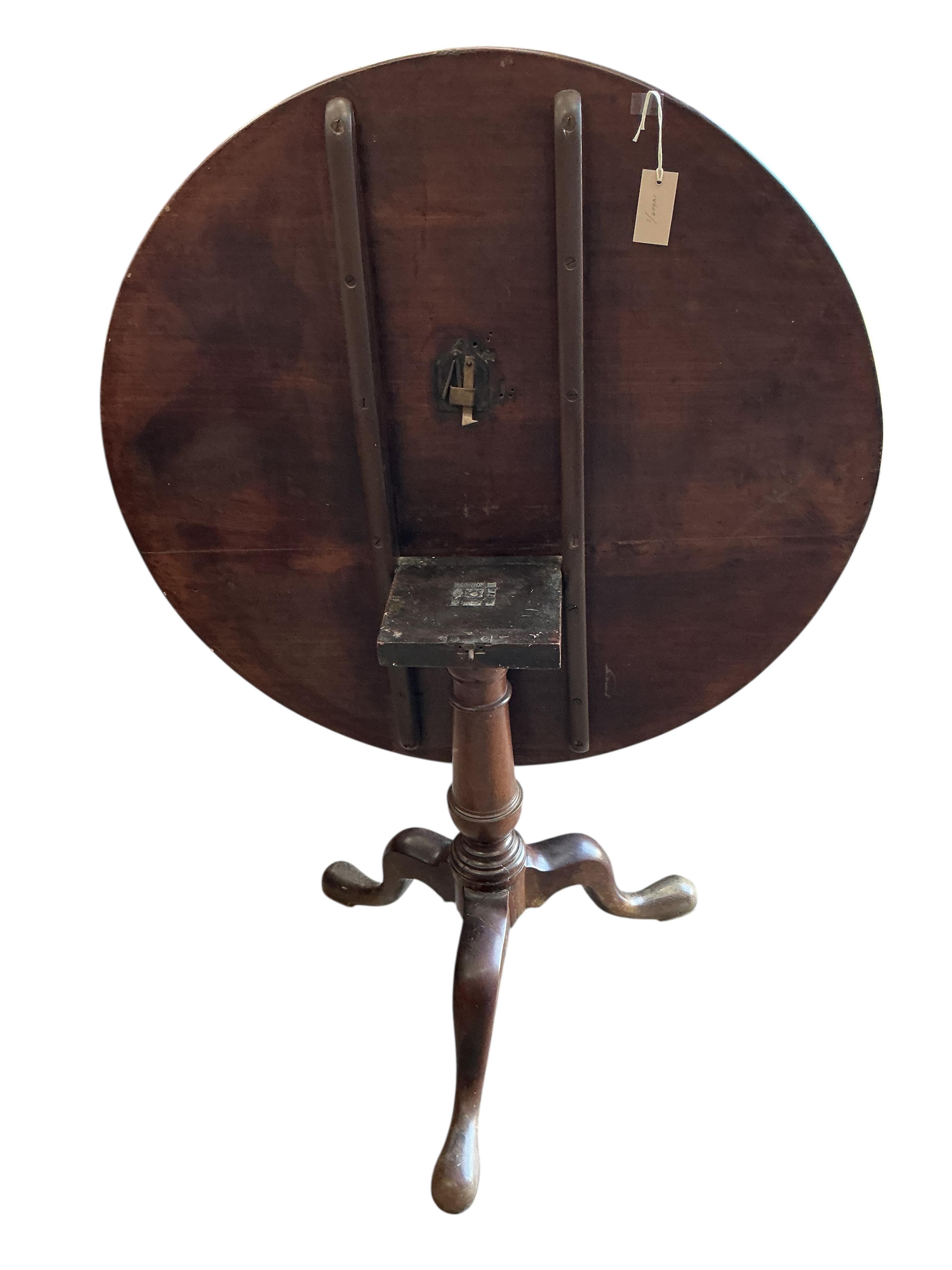 A George III circular mahogany tilt top tripod tea table, diameter 91cm, height 72cm
